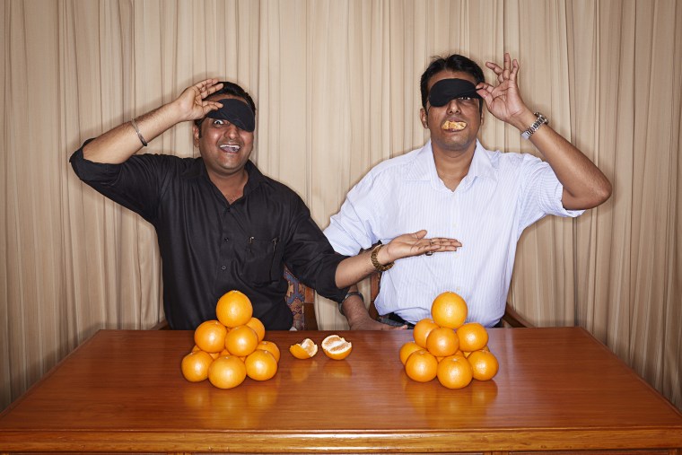 Dinesh &amp; Manish Upadhyaya - Fastest time to peel and eat an orange blindfolded (team of two)
Guinness World Records 2014
Photo Credit: Ranald Mackechnie/Guinness World Records